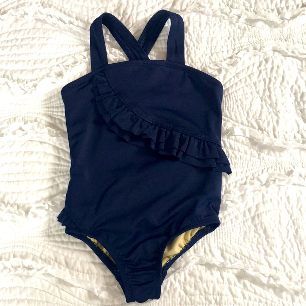 Navy toddler ruffled bathing suit.